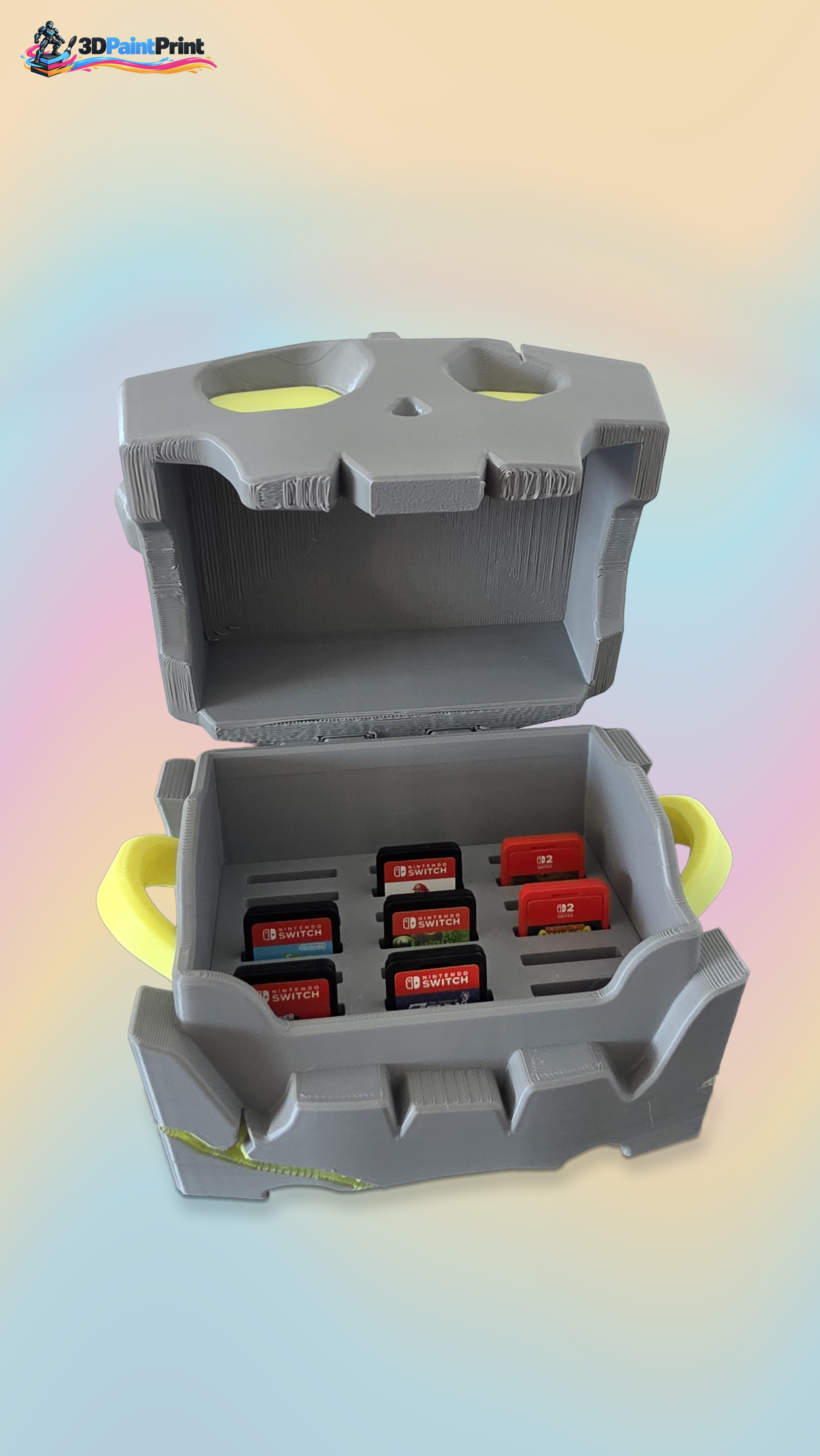 Open grey and yellow 3D-printed game-cartridge storage box, with cartridges shown for scale.