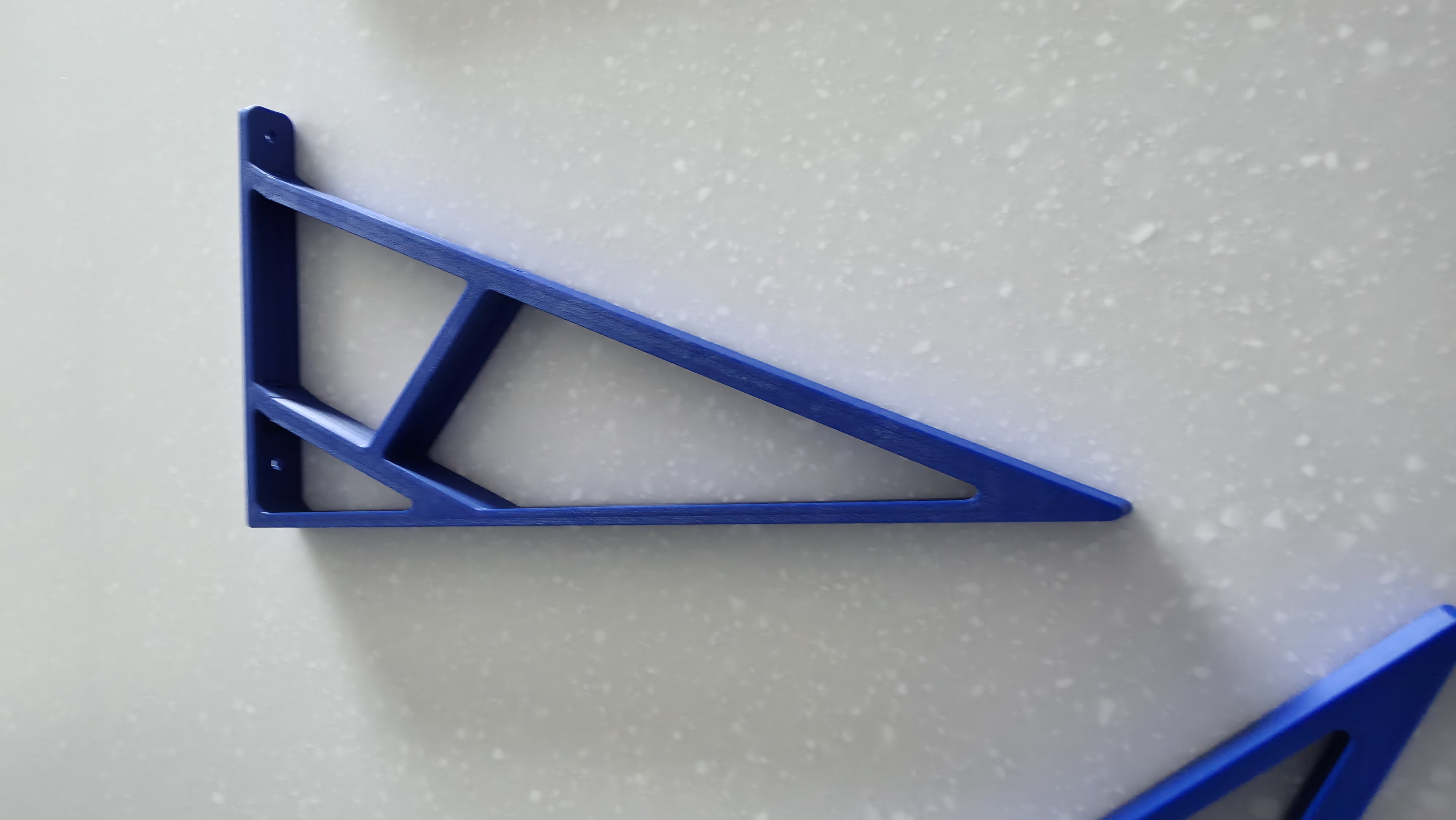 The printed blue bracket, shown on its own.